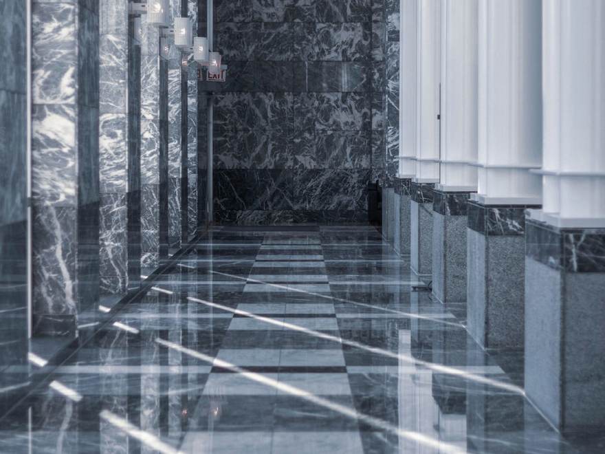 Polished stone floor in a colonnaded entrance hall