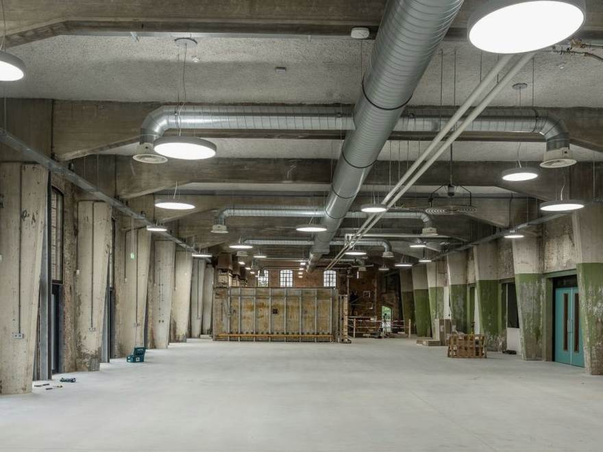 Open utility floor, bare concrete slab ready for a coating