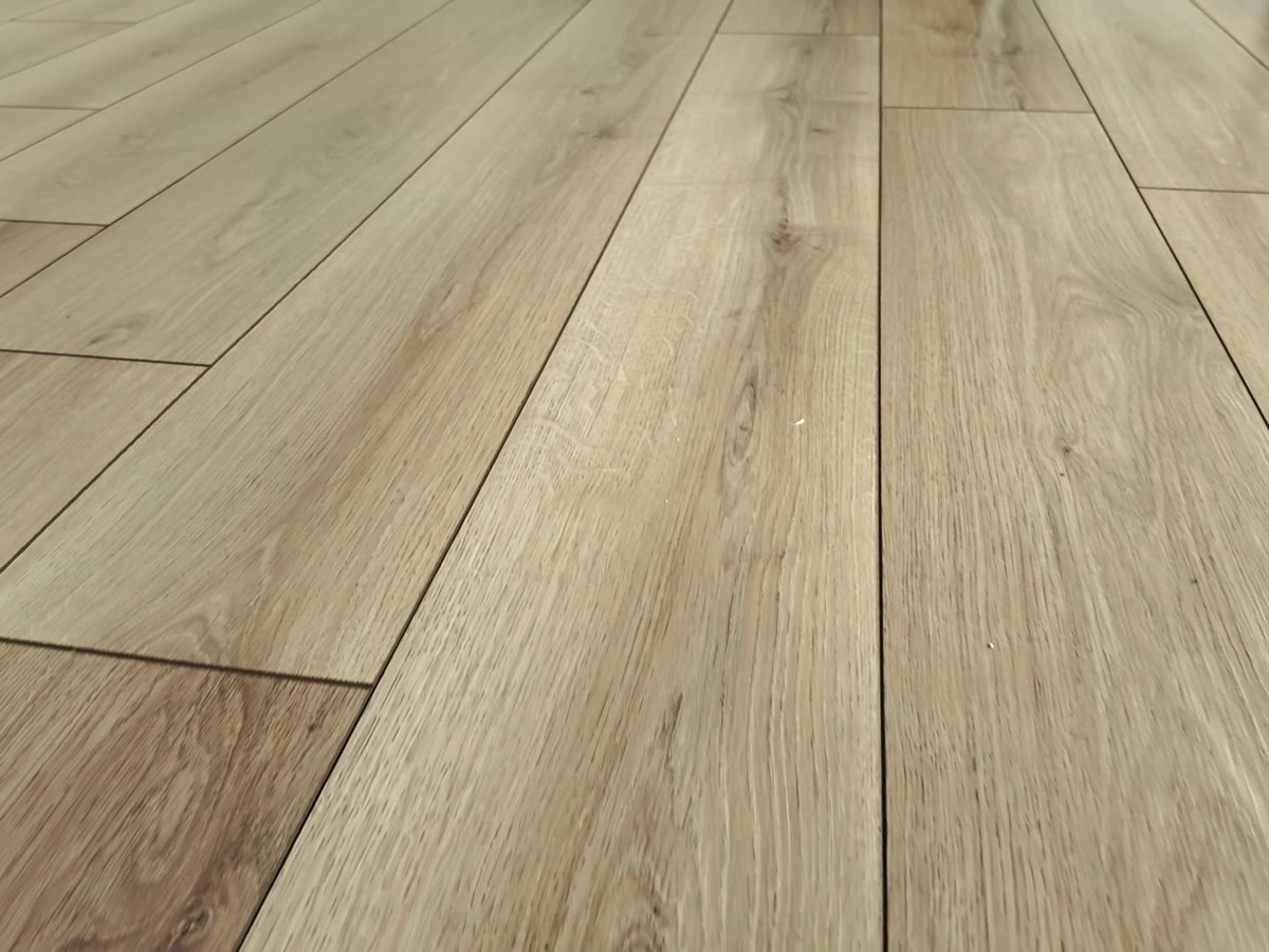 Finished oak floor running the length of a room