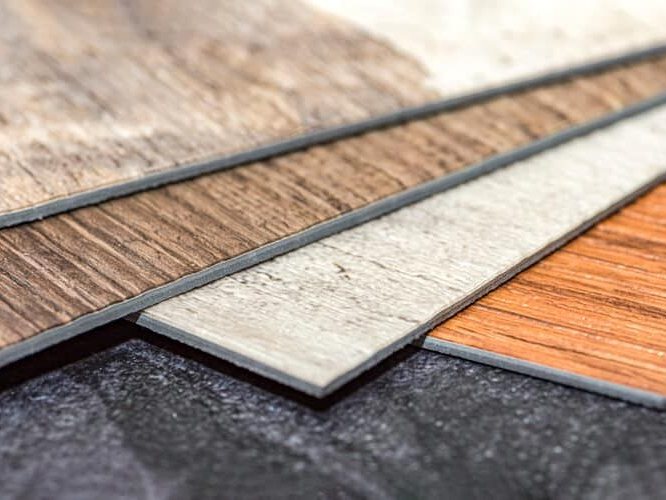 Vinyl plank samples in wood and stone finishes